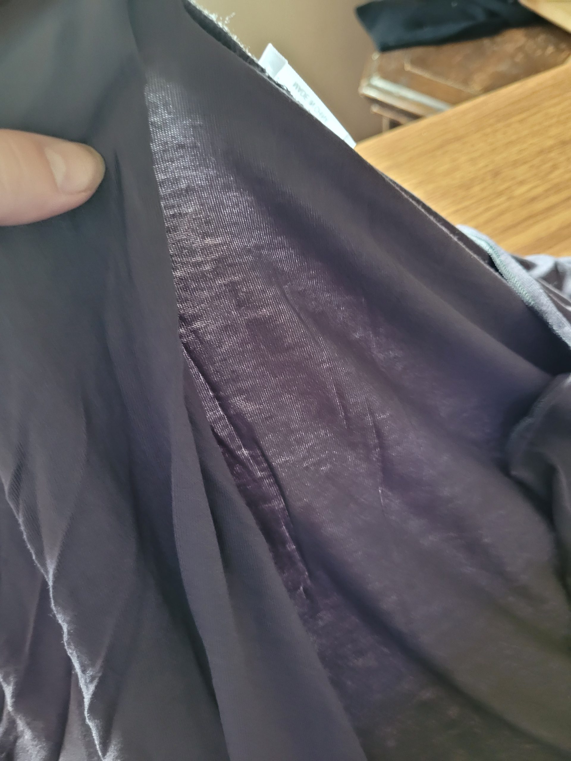 Showing thinness of fabric for In'voland cardigan
